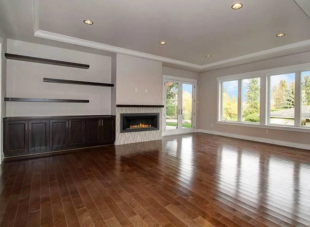 The living area with a built-in fireplace and cabinet.