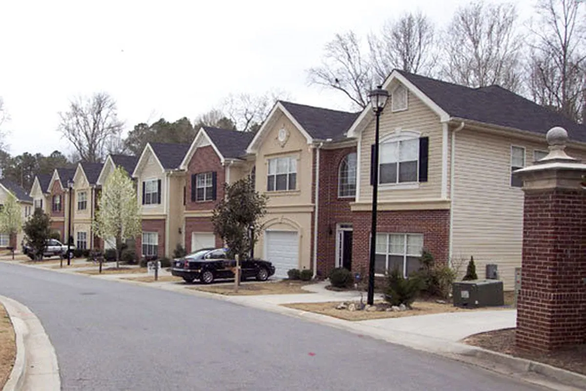 The 12-unit home is seen from the main road in the distance.