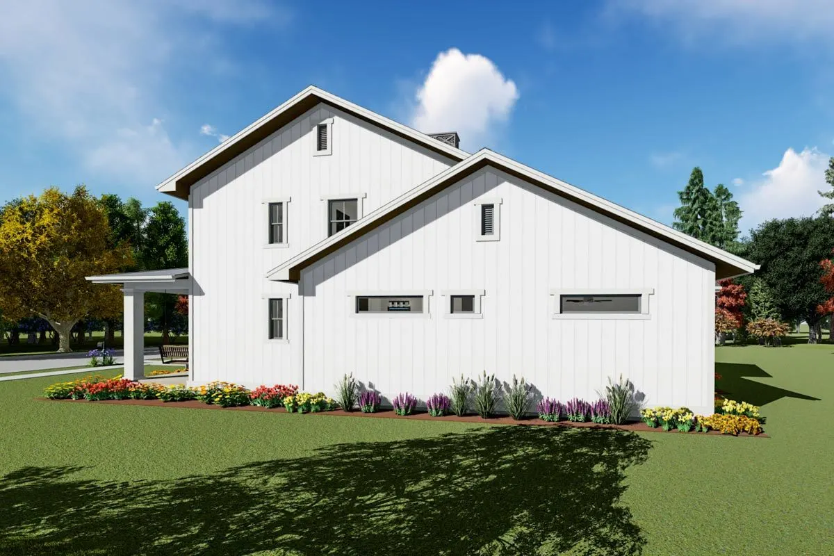 The right side of the home with surrounded flowers enhances curb appeal.