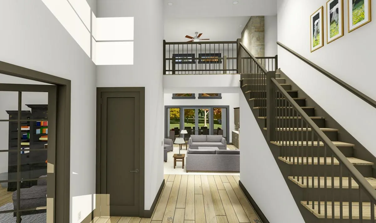 The inside of the main entry has a wooden accentuated style with flooring and staircases.