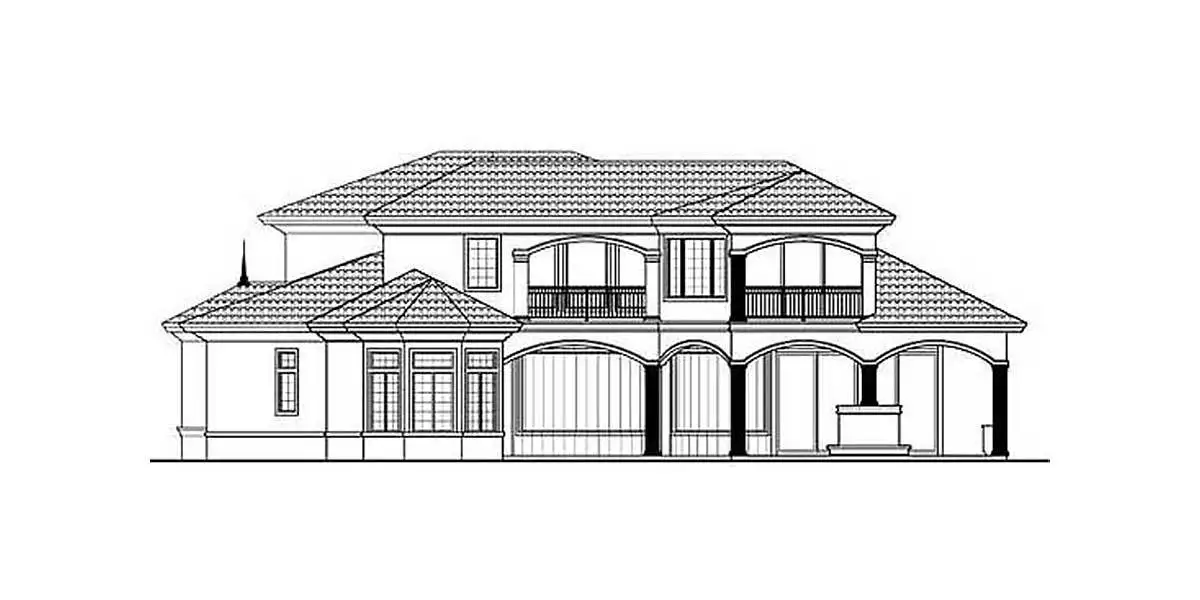 The two-story, four-bedroom Mediterranean home in Florida is seen from the left.