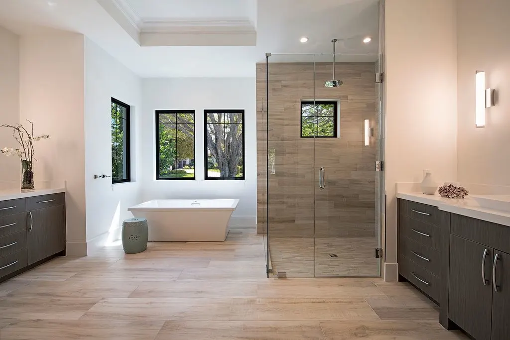 The master bathroom with a tub, shower, and vanity.