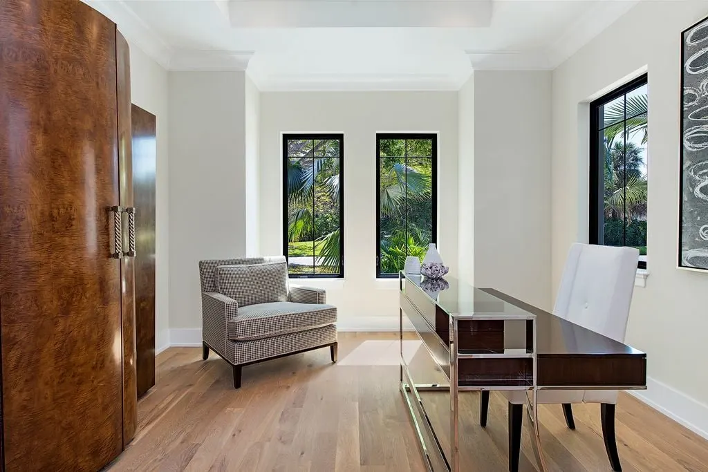 Elegant study table and chairs with a wonderful sleek wood cabinet.