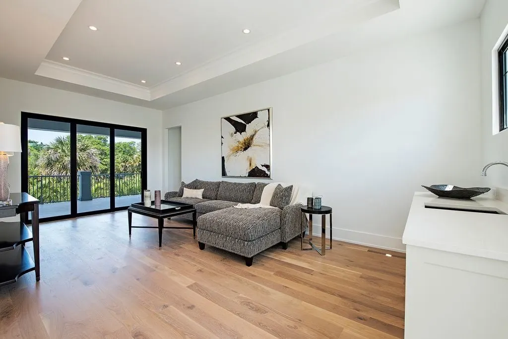 Second-story lounge with a wooden floor design.