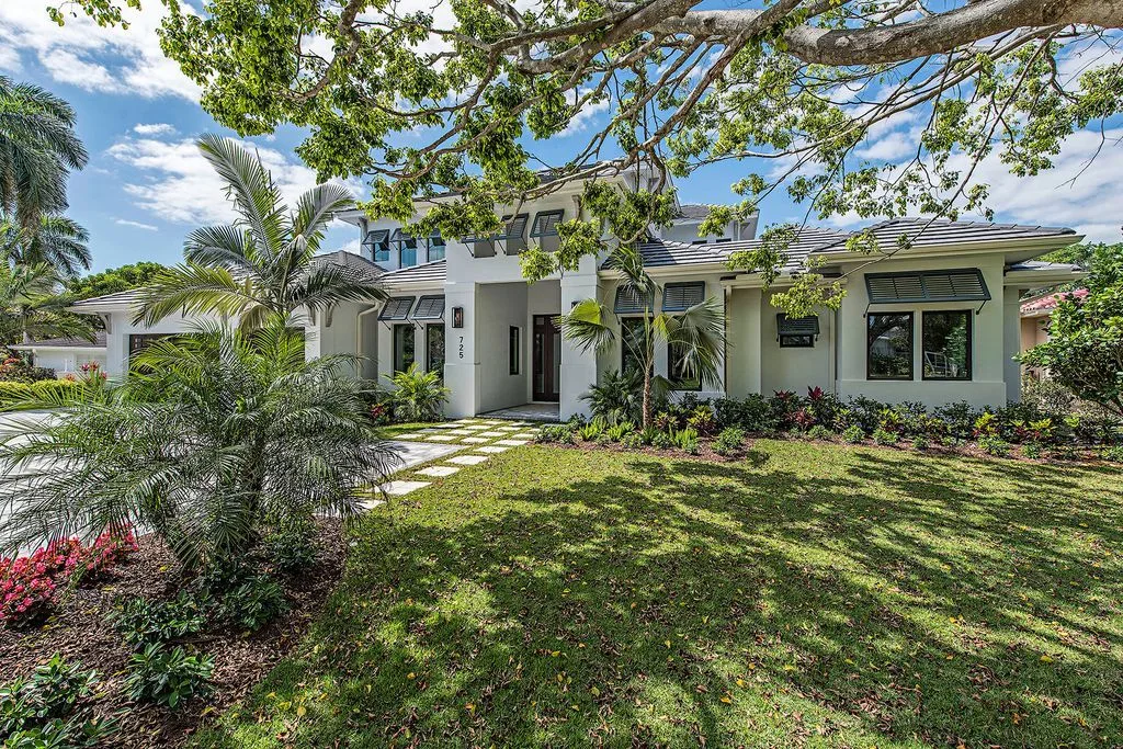 The front of the house has a lively front yard landscaping.
