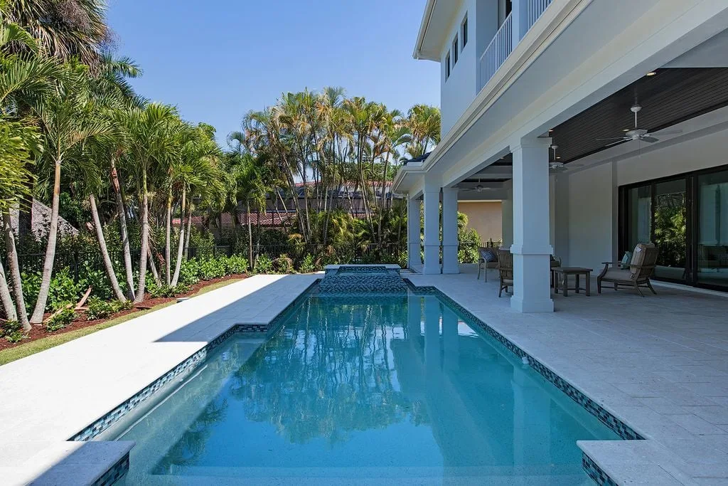 The pool area with a hot tub has an excellent design layout.
