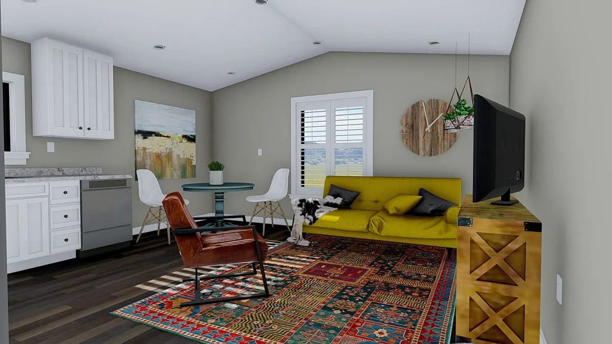 The great room area with a cozy couch in a mustard color.