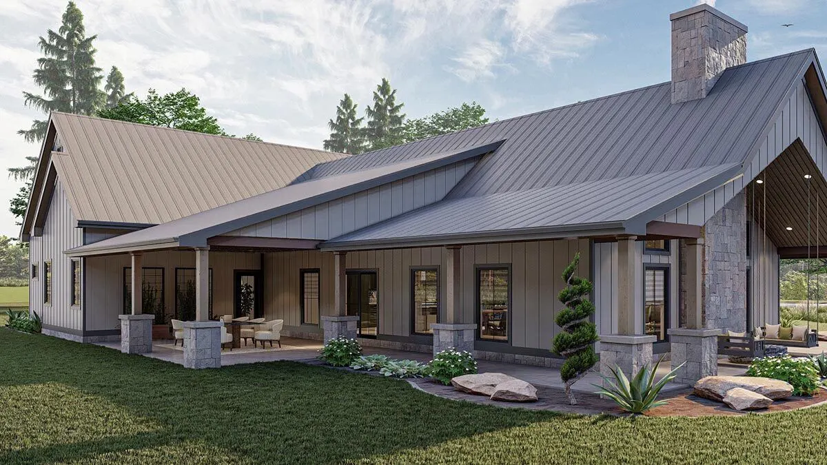Wraparound covered patio area with wood pillars and stone flooring.