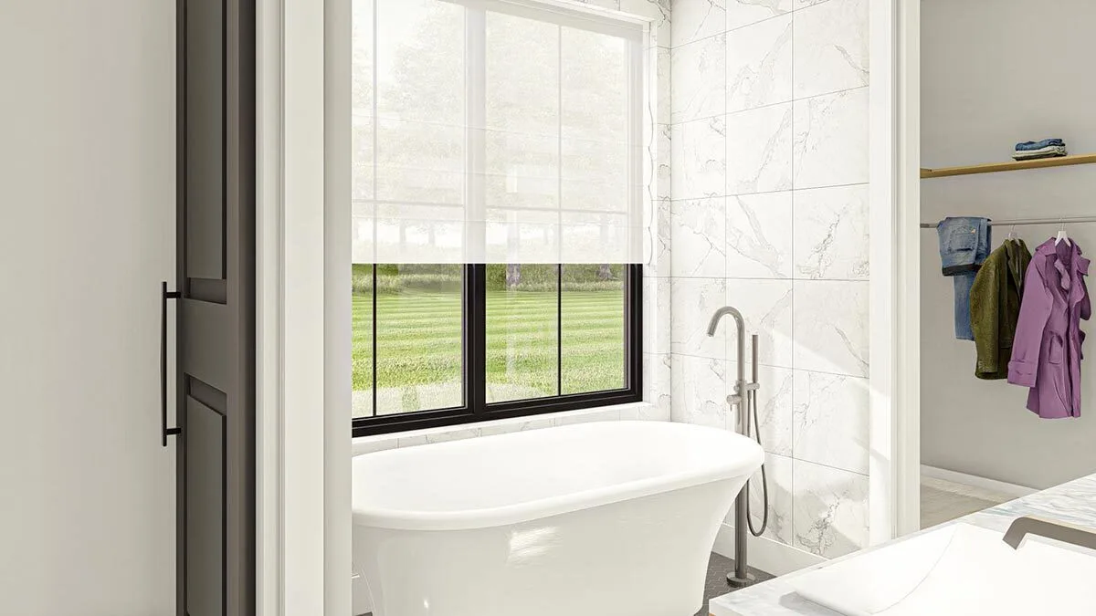 Master bathroom with apparent walk-in closet area in a clean and sleek style.