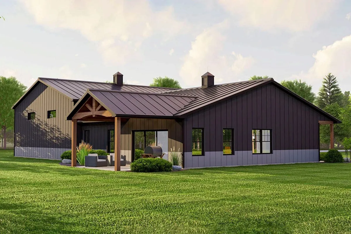 Covered porch at the back with a lounge chair and grilling area.