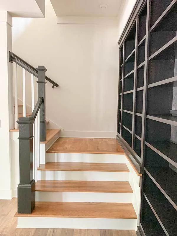 Wood accent stair and dark color handrail.