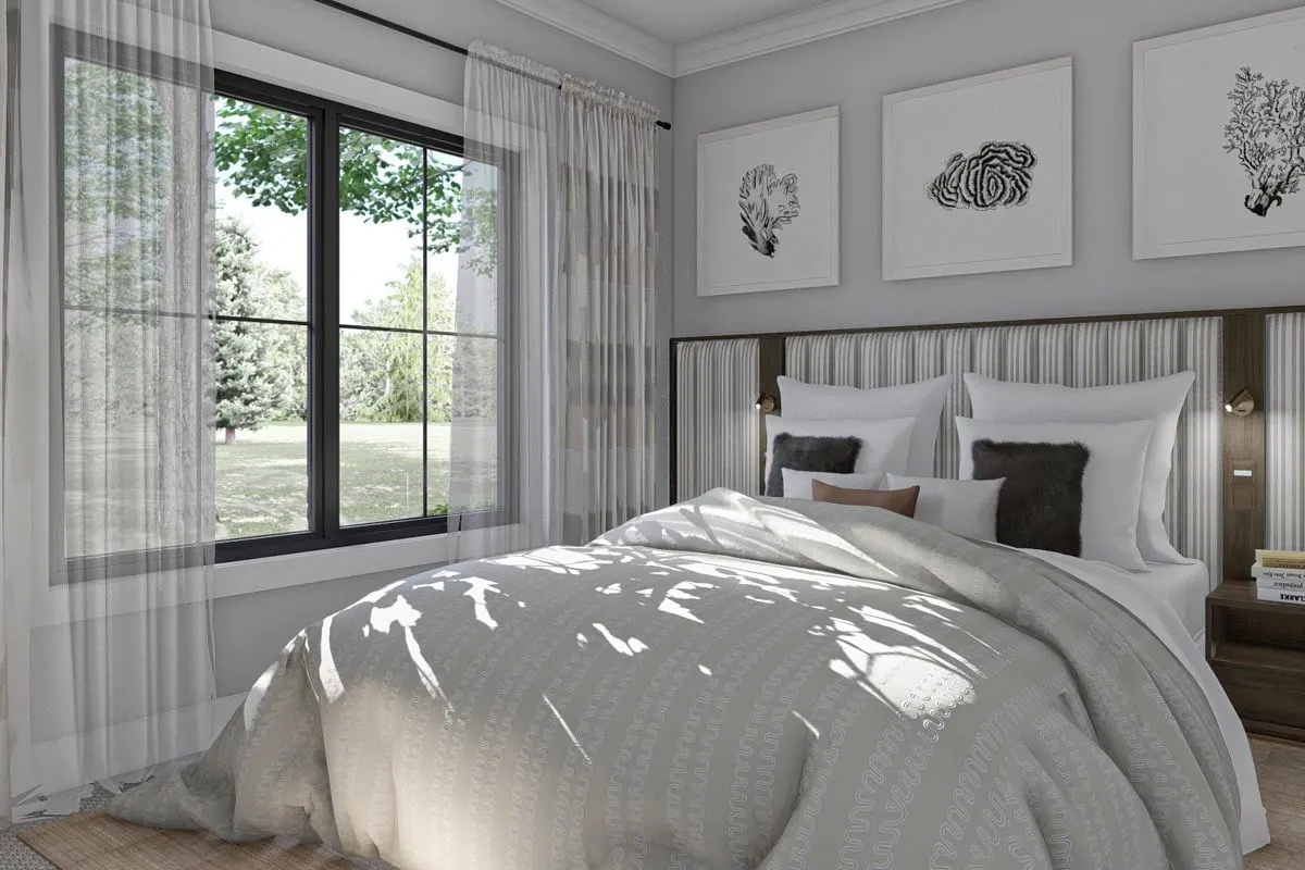 Stylish bedroom with a bed near the window in black trim.