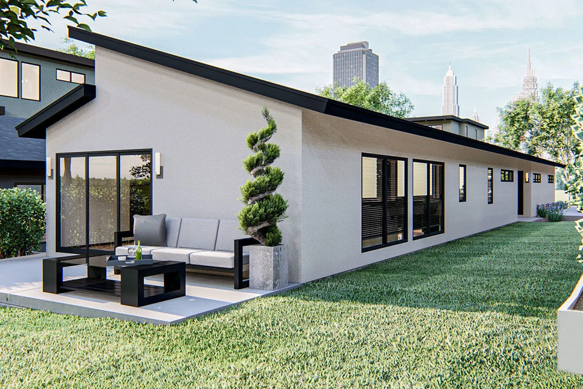 The right side of the house with a view of the patio area with lounging.