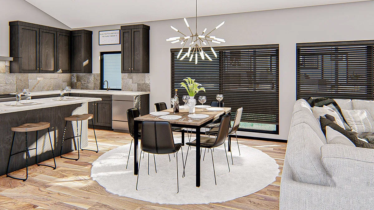 Dining and kitchen area in dark wood accent with stylish chandelier.