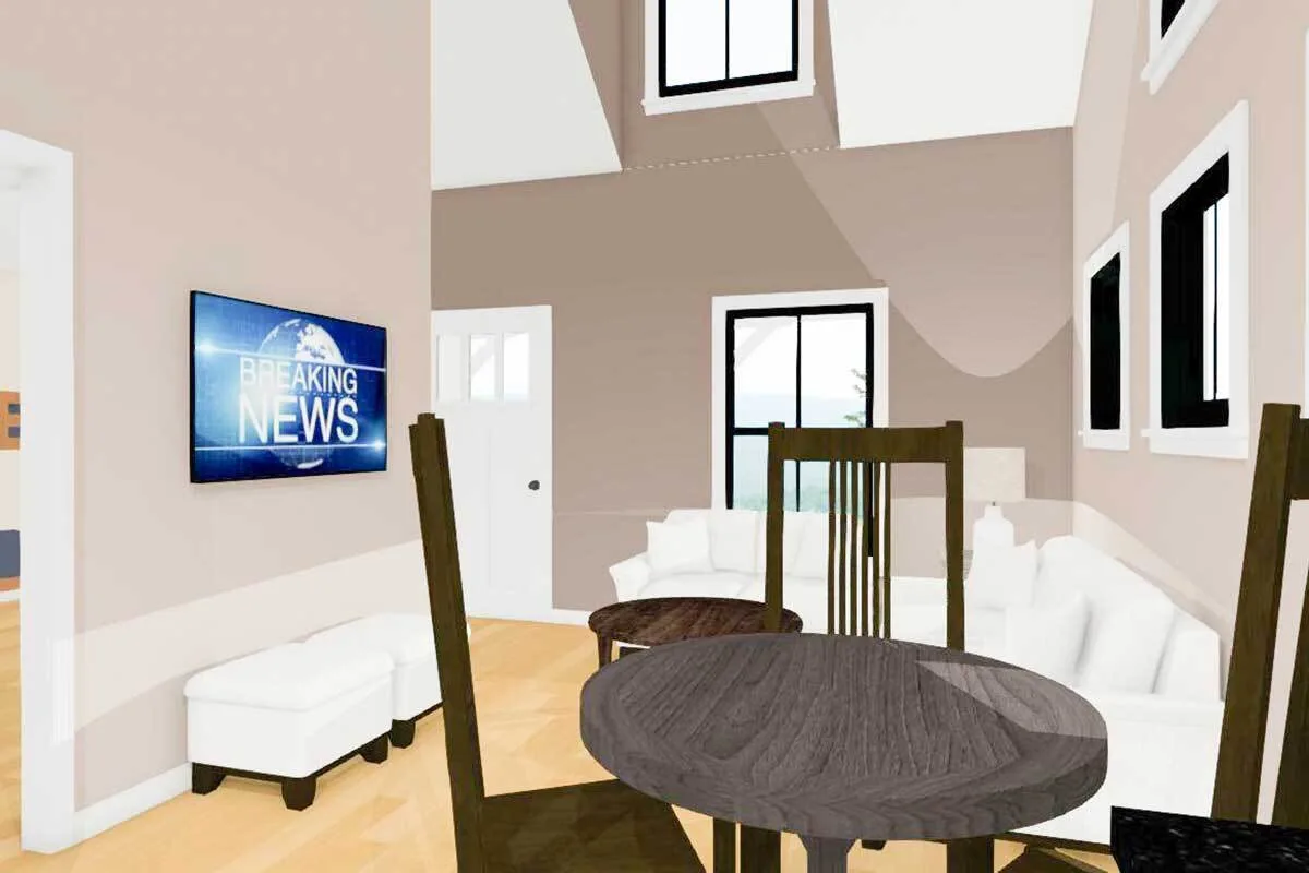 The living room area with white sofa and a wooden round dining set.