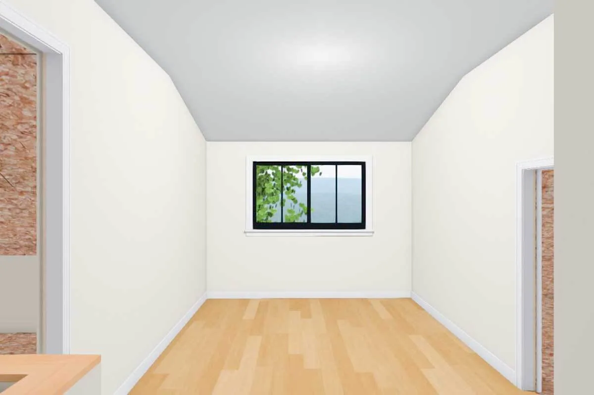 A window in the ceiling slopes down layout of the loft section with the wooden accent floor.