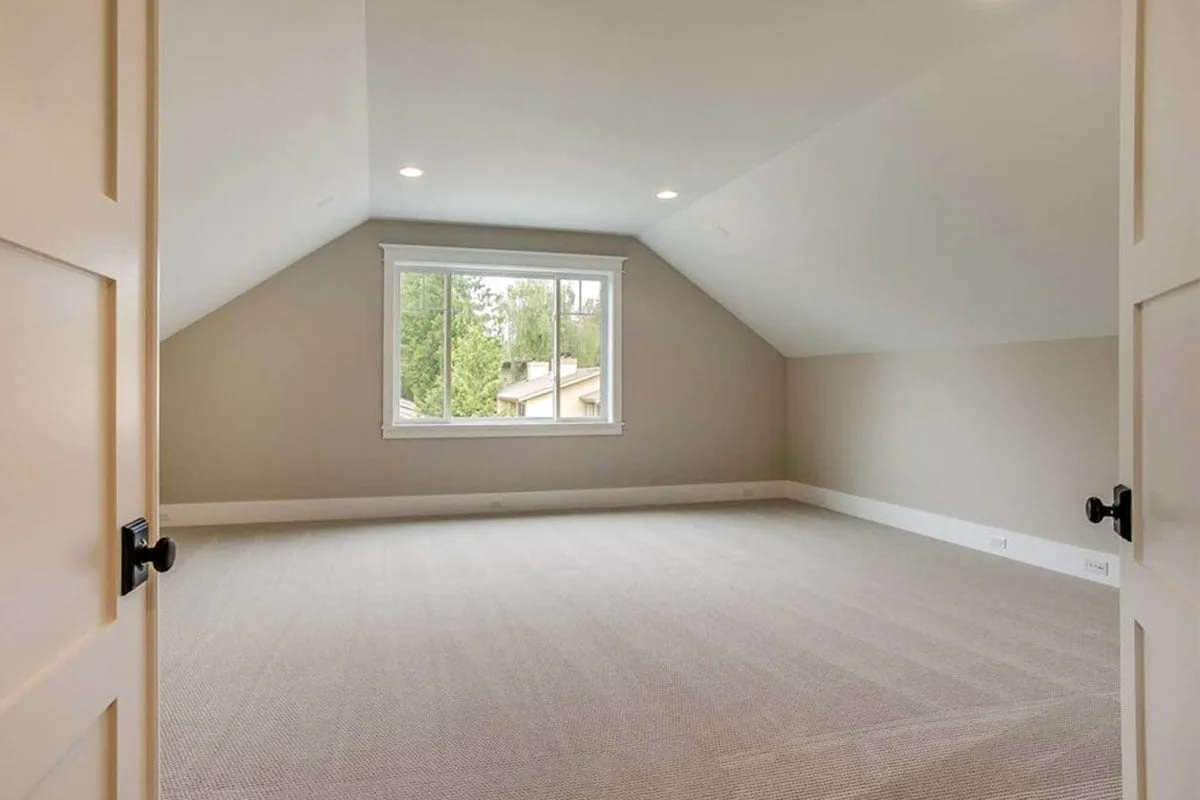 Media room with a carpeted floor and a large window feature.