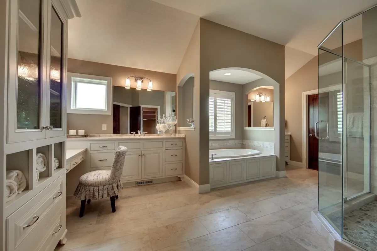 Master bathroom with linen cabinet near vanity area.