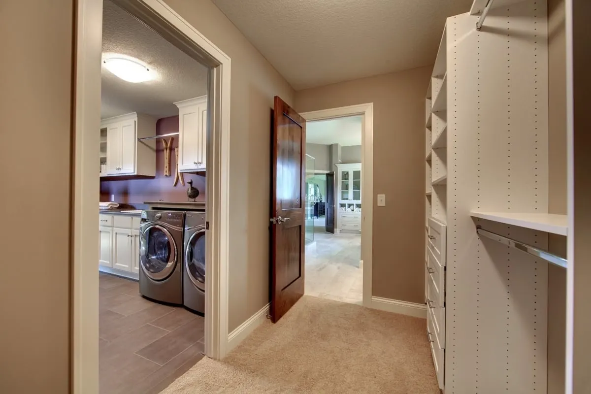 Laundry room with access to the walk-in closet.