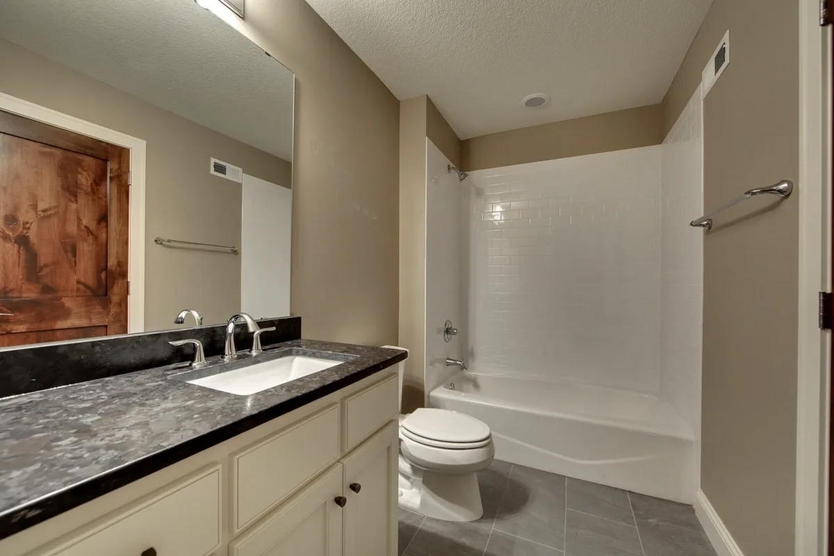 Bathroom with a modern black and white decor.