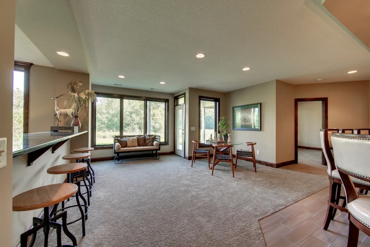 A large gaming room area with plenty of seating.