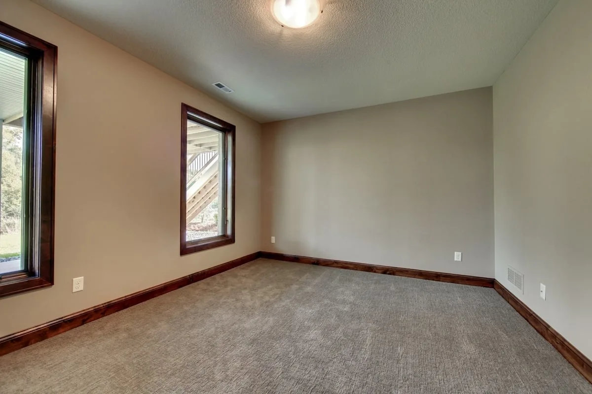 A bedroom space with a wood trim style stands out in the interior.