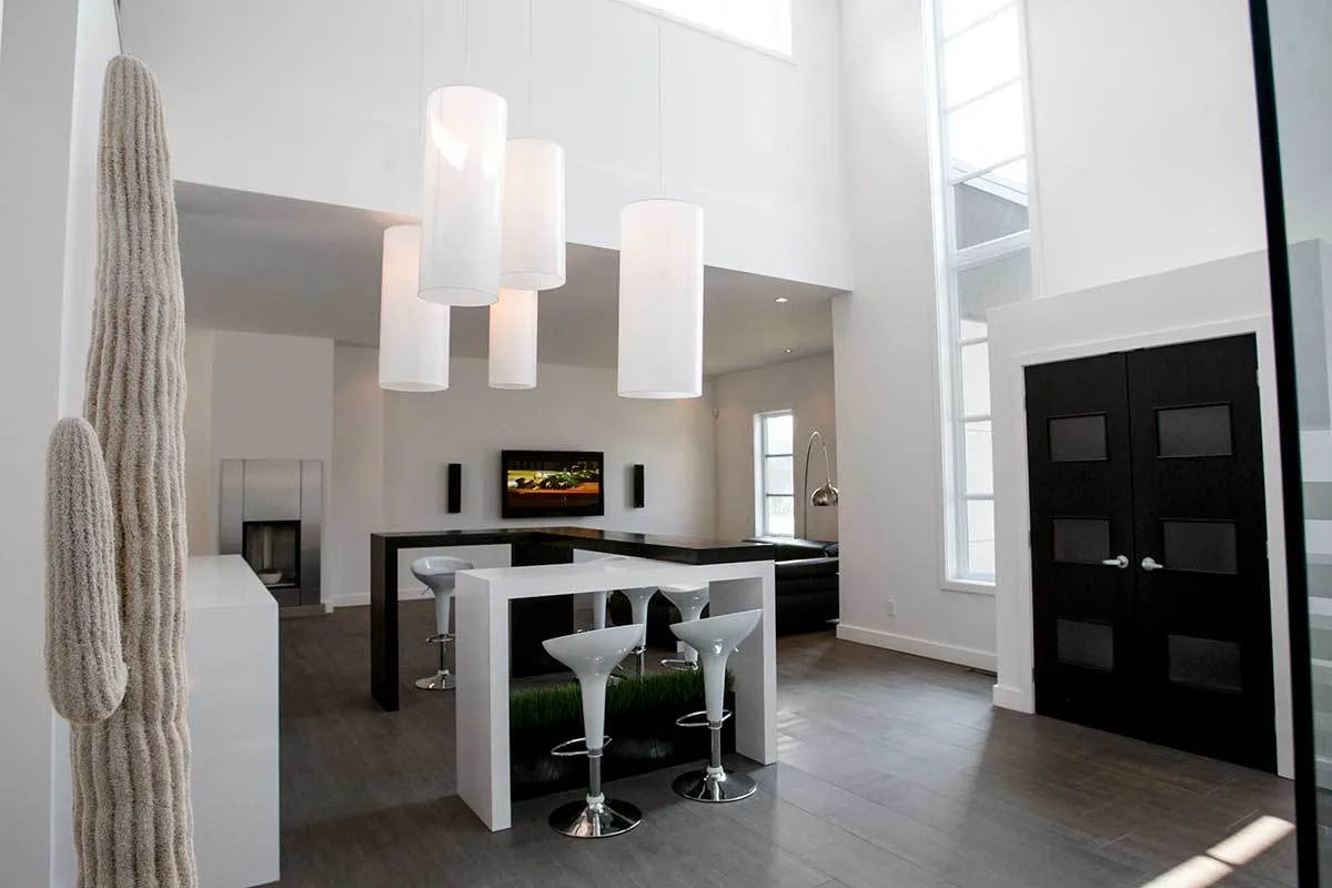 A black and white contemporary décor can be seen in the home's foyer.