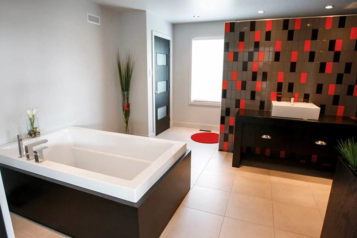 Bathroom area with a modest design and accent colors of brown and red.