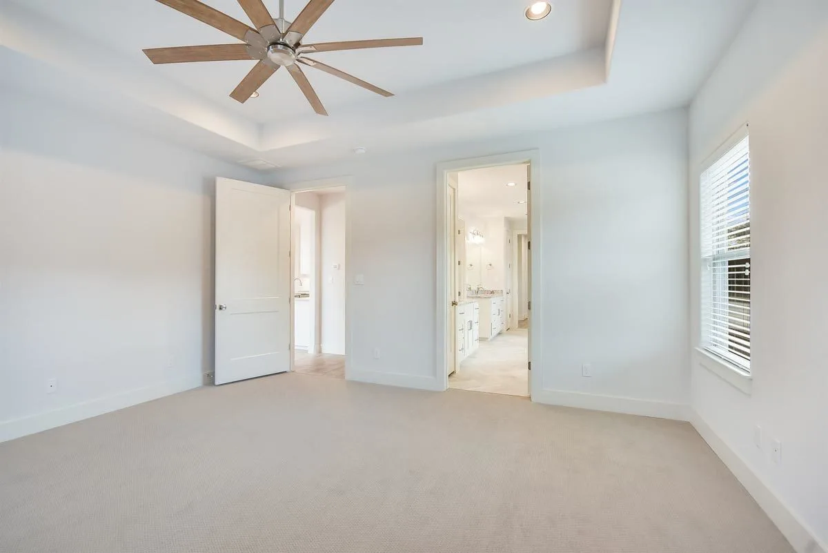 Doors to the master bathroom and hallway to the dining area.