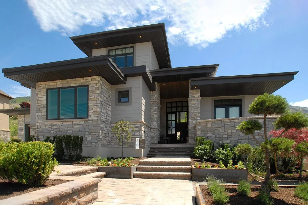 Front of the house seeing a beautiful landscape with a courtyard on the right side.